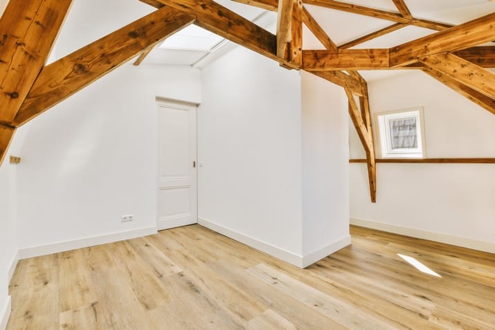a-living-room-with-white-walls-and-a-wooden-ceiling-2